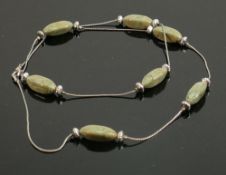 Polished dark green stone necklace: