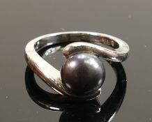 Silver ladies cross over ring set with charcoal stone: size P, 5.5g.