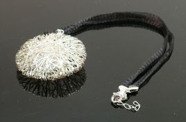 Silver sunburst pendant necklace: