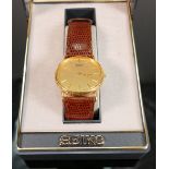 Seiko quartz gentlemans gold plated wristwatch: with leather strap, boxed.