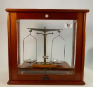 Philip Harris mahogany cased scientific balance: Complete with weights, 42cm wide.