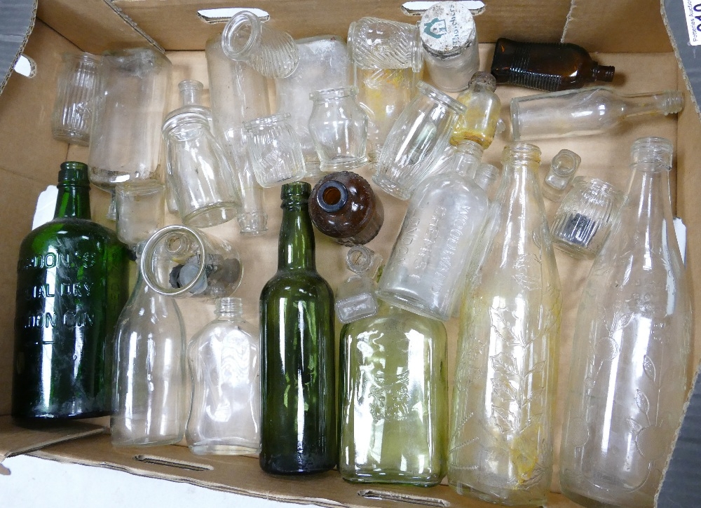 A collection of vinatge glass bottles including: roses Lime Water, Gordons Gin, Woodward Chemists - Image 2 of 2