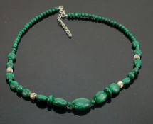 Polished green coloured stone and silver necklace: