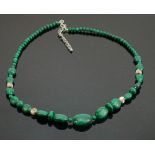 Polished green coloured stone and silver necklace: