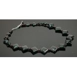 Costume polished brown stones necklace; with silver clasp.