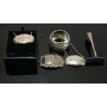 Group of silver including wine labels: Three assorted hallmarked spirit labels, napkin ring a/f, and