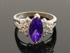 Ladies silver dress ring with purple & white stones: size N, 3.5g.