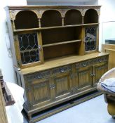 Carved Oak Linen fold Four Door Sideboard: with display cabinet top, length 187cm, depth 49cm and
