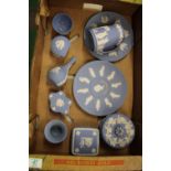 A collection of Wedgwood jasper ware: to include lidded boxes, vases, commemorative plates and jug