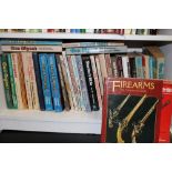 A large collection of books with a firearms/guns/shooting theme: 1 shelf.