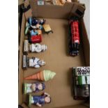 A mixed collection of items to include: train theme money boxes, small condiment figures including