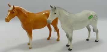 Two Beswick small thoroughbred stallions: 1992. one palomino and one grey (2)