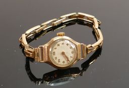 ladies vintage 9ct gold wristwatch: with rolled gold expandable strap.