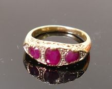 9ct gold diamond and red stone ring; Weight 2.9g, size K. Yellow coloured metal tested as 9ct or
