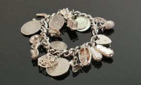 Silver charm bracelet with 19 charms, 101.4g: