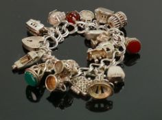 Silver charm bracelet with 21 charms, 91g: