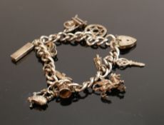 Silver charm bracelet with 10 charms, 36.7g: