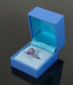Sterling silver ring set with oval purple stone: QVC brand new and boxed.2.5g.