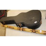 A Didgeridoo: together with a vintage hard guitar case (2).