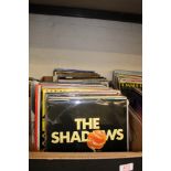 A large collection of vinyl albums including: Shirley Bassey, The Shadows, Rod Stewart etc 2 trays.