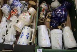 A mixed collection of ceramic items: vases, jugs, continental figures etc (2 trays).