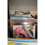 A large collection of vinyl albums including: Rock, Elvis, Blues, etc 2 trays.