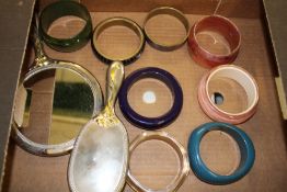 8 ladies vintage bangles: together with a matching white metal hand mirror and hair brush (1 tray).
