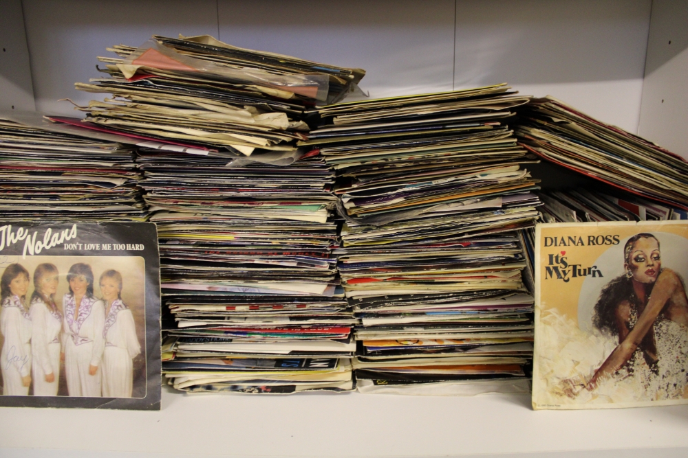 A collection of 45 rpm singles 1970's/1980's mixed genres: viewing advised.