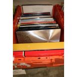 A large collection of vinyl albums including: 1980's, Now Hits, classic rock etc 1 box.