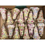 A collection of Nelson Ware sugar sifters: floral/chintz pattern x 16.