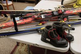 A collection of ski's: asolo sport snow field 2 boots and poles. to include Head, Volka