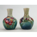 Pair of Walter Moorcroft Freesia vases on green blue ground: Height 12cm. (2)