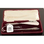 Cased large and small button hook and shoe horn: With filled silver handles.