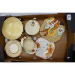 A collection of Hand Decorated pottery to include Clarice Cliff Saucers, Side Plates & sugar bowl,