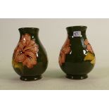 Moorcroft Hibiscus on Green Ground pair of vases: height of each 10cm(2)
