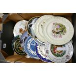 A mixed collection of decorative wall plates: