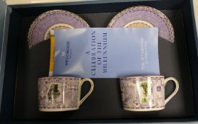 A collection of boxed Wedgwood cups and saucers from the 19th, 20th and 21st Millenium Collection(3)