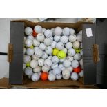 A large collection of used golf balls: