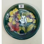 Moorcroft Hibiscus charger: on green. 26cm diameter