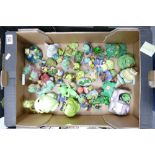 A large collection of novelty frog ornaments: