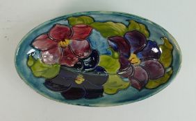 Moorcroft Clematis on blue ground oval dish: Diameter at largest 23cm, Queen Mary sticker noted.