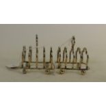 Pair of silver toast racks Sheffield 1928: Weight 157 grams.