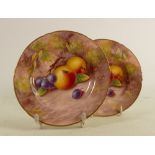 A pair of Royal Worcester plates, decorated with fruit by L Maybury: Circa 1954, diameter 15.5cm. (