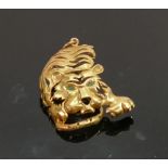 18ct gold tiger pendant set 2 emeralds: Gross weight 19.4g. Height 60mm overall.