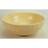 Wedgwood footed bowl in straw glaze: Designed by Keith Murray, diameter 24cm. (Slight crazing).