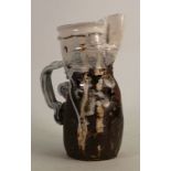 Simon Carroll earthenware jug dated 2000: Having a rimmed impressed neck and a scrolled grey handle,