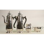 Silver four piece decorative coffee set: Hallmarked for Sheffield 1972, wooden handles to coffee &