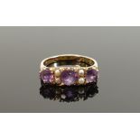 9ct gold three stone amethyst & seed pearl ring: Size N, 3.3g.