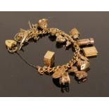 16 x 9ct gold charms on ROLLED GOLD charm bracelet: Charms are either hallmarked 9ct gold or