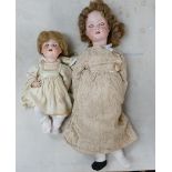 Two pottery headed German dolls marked: C M Bergmann 1916 Germany 7a (head detached & fingers